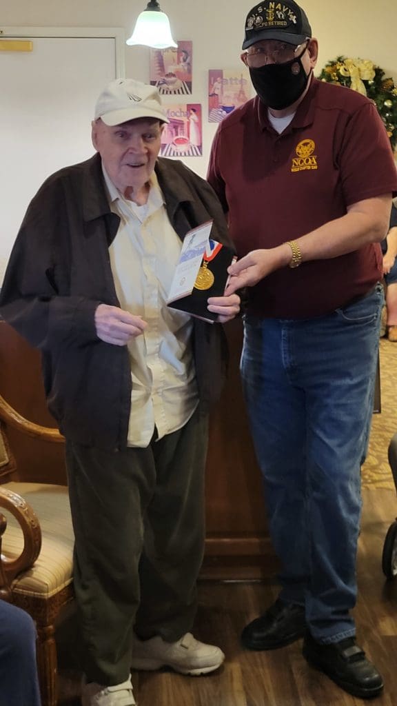Army veteran Elie Morrell receives WW2 medallion from Chairman Haines