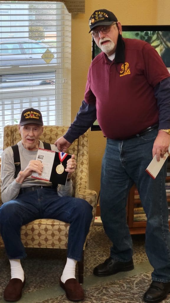 Army veteran Jay Hayes receives WW2 medallion from Chairman Haines